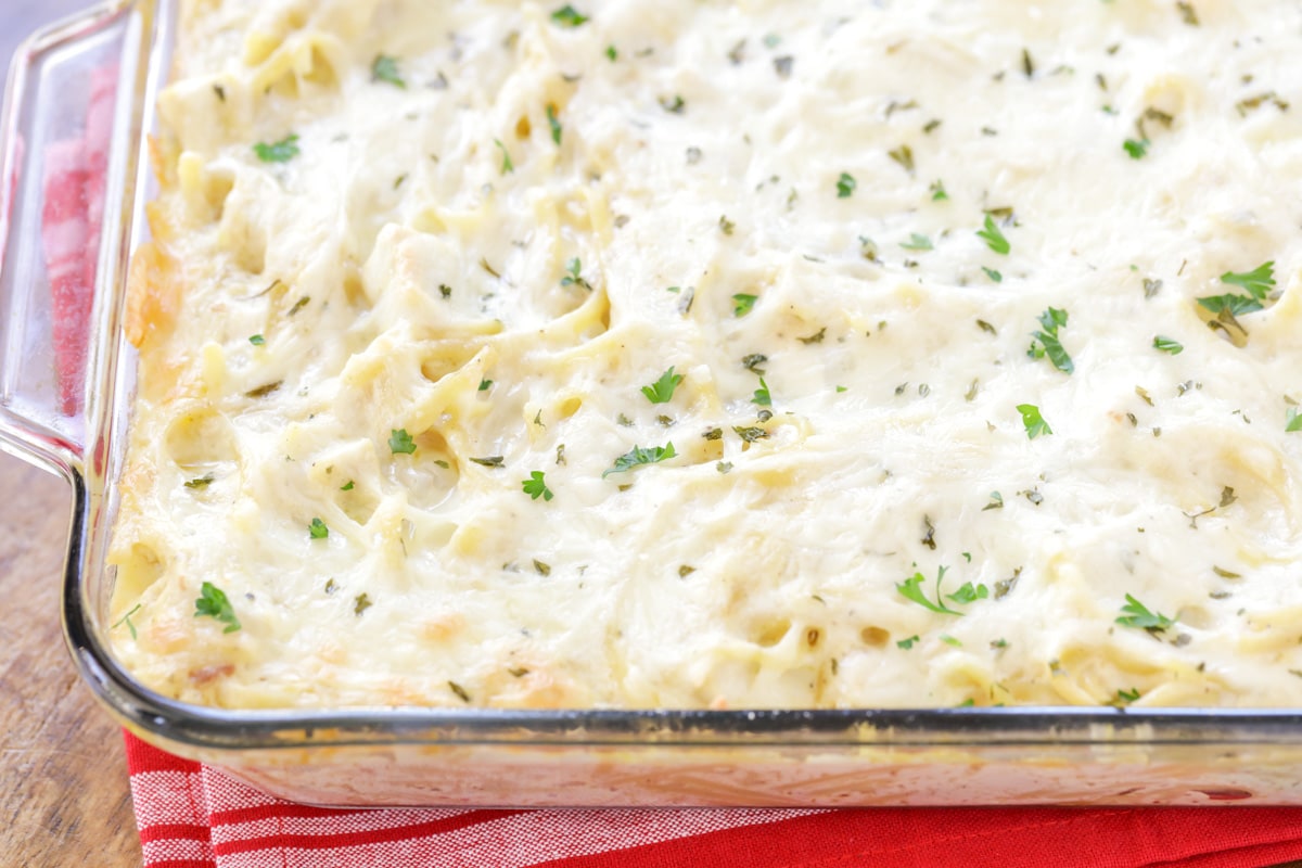 Easy, creamy, and utterly delicious cheesy chicken tetrazzini is a family favorite that takes minutes to prep! Baked pasta and chicken topped with cheese and fresh herbs.
