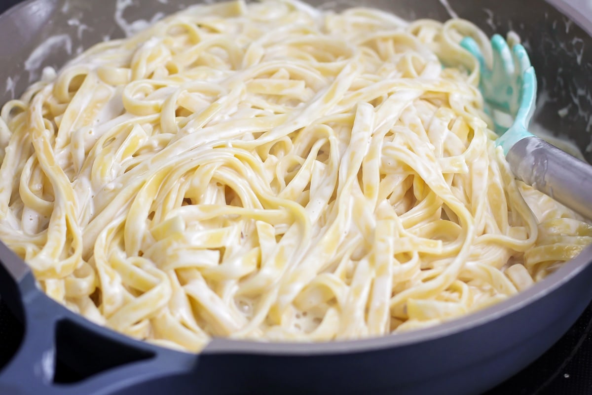 Indulge in the rich and comforting flavors of this Fettuccine Alfredo recipe that's on the table in only 30 minutes! Fettuccine Alfredo recipe made in large skillet.