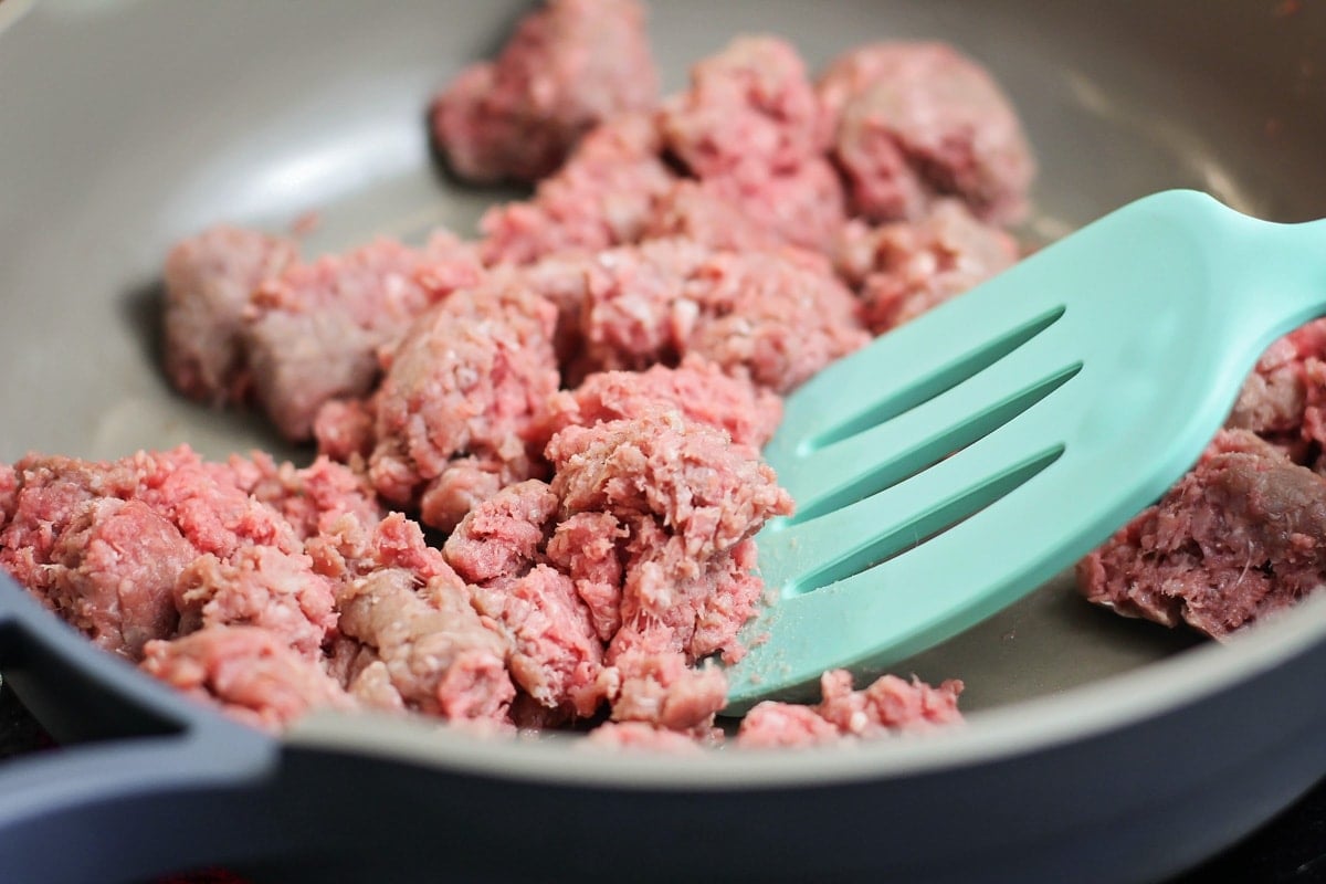 Better than the box, Homemade Hamburger Helper is a perfect one-pot meal that comes together in under 30 minutes! Cooking ground beef in a skillet for homemade hamburger helper.