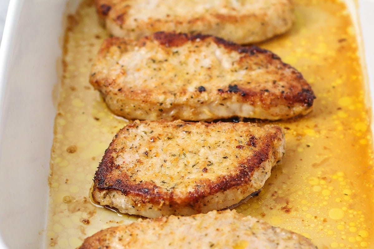 Crusted with parmesan and fried up with less than 10 minutes of prep work, this is definitely the best pork chop recipe you'll ever try!! Parmesan pork chops baked in baking dish.