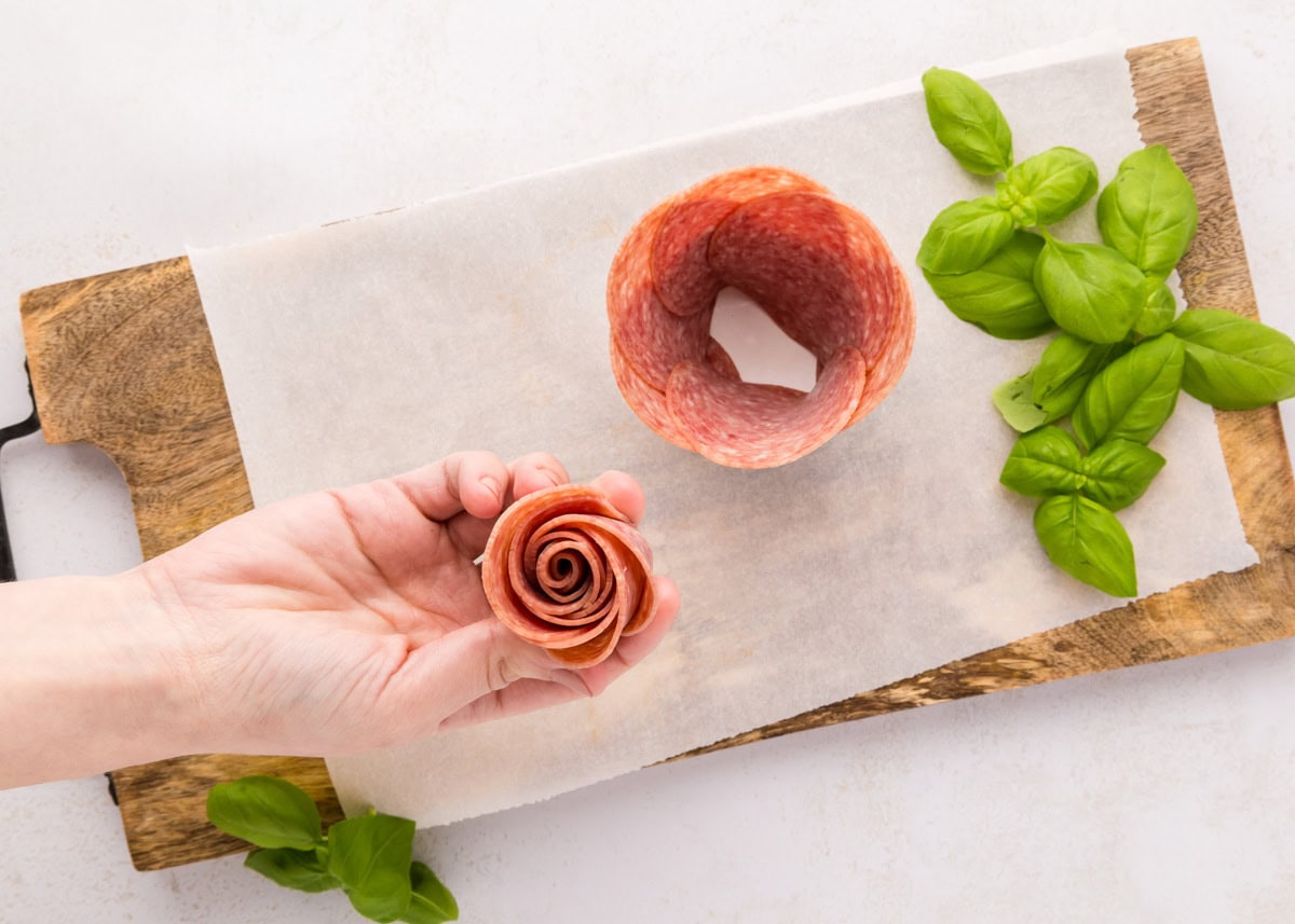 Follow these step-by-step instructions to create a beautiful salami rose - a deliciously elegant centerpiece for your snack boards! Rolled salami to place in a jar.
